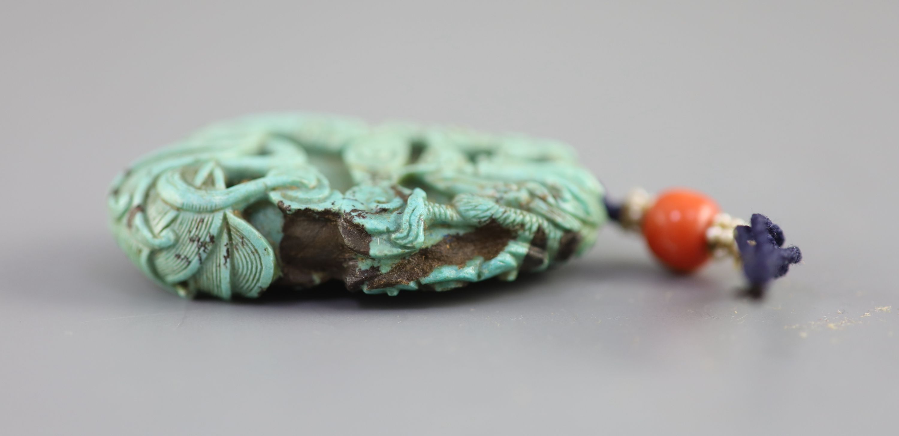 A Chinese turquoise matrix ‘dragon’ pendant, 19th century 5.4cm long